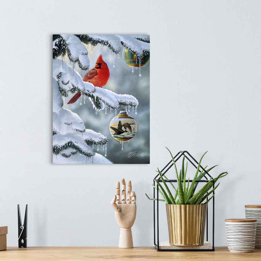 A bohemian room featuring A male cardinal sitting on a snow covered branch with a christmas ball, ornament hanging from the...