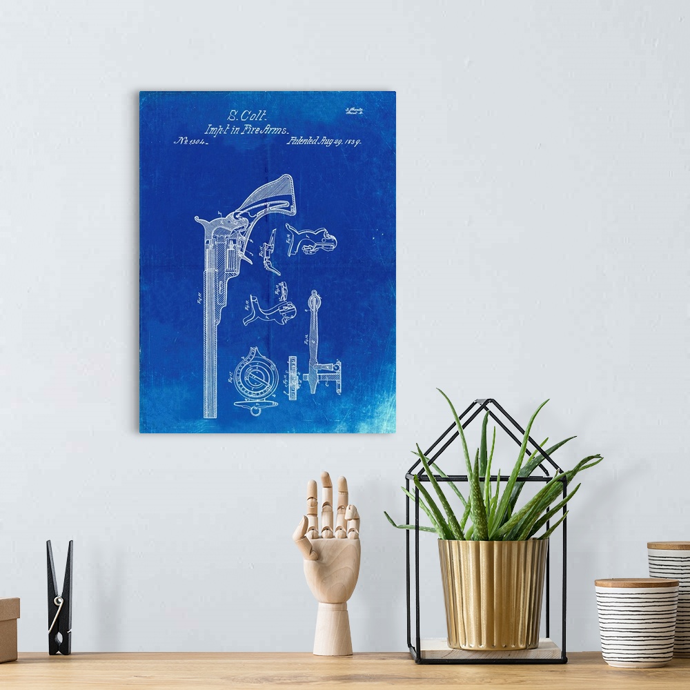A bohemian room featuring Faded Blueprint Colt Paterson Patent Poster