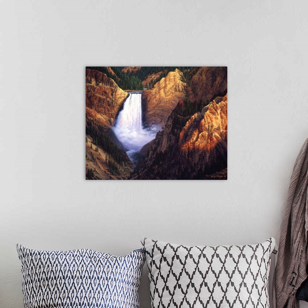 A bohemian room featuring A waterfall is surrounded by large rocky cliffs in a canyon.