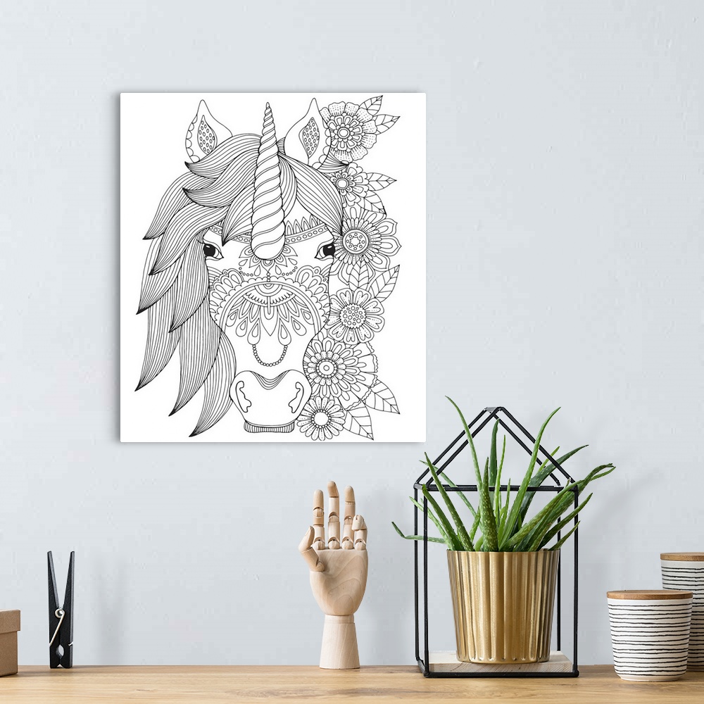 A bohemian room featuring Black and white line art of a unicorn head with a line of flowers flowing down the right side.