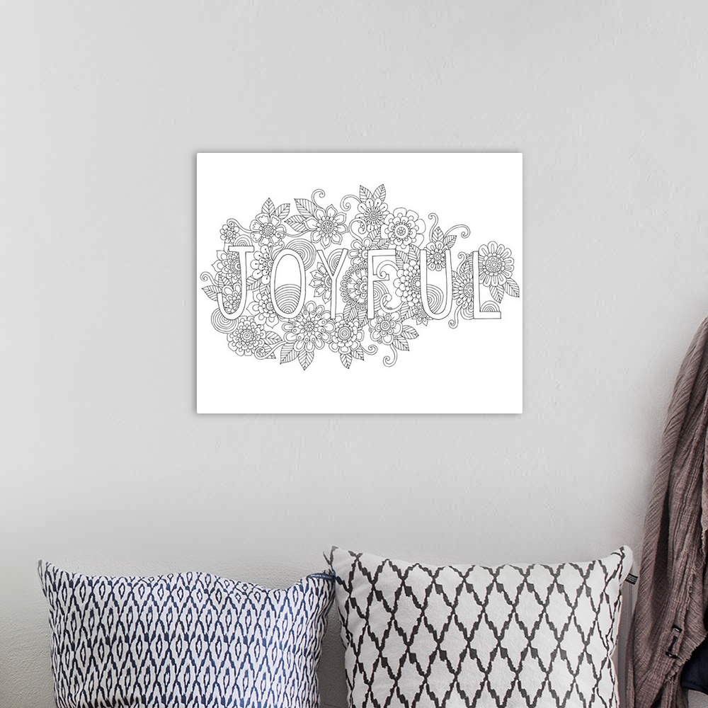 A bohemian room featuring Black and white line art with the word "Joyful" surrounded by a floral design.