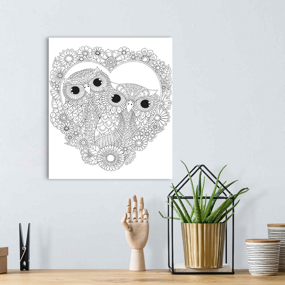 A bohemian room featuring Black and white line art of two owls inside a heart made out of flowers.