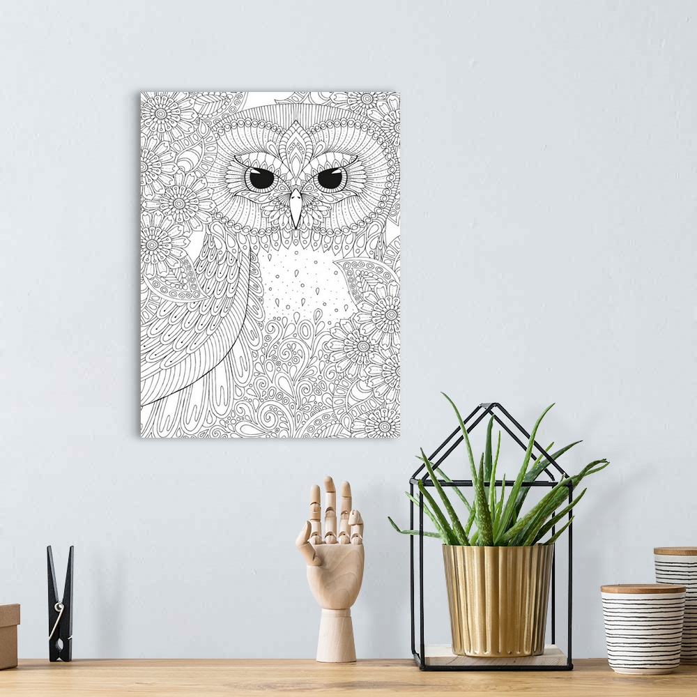 A bohemian room featuring Black and white line art of an intricately designed owl surrounded by flowers.