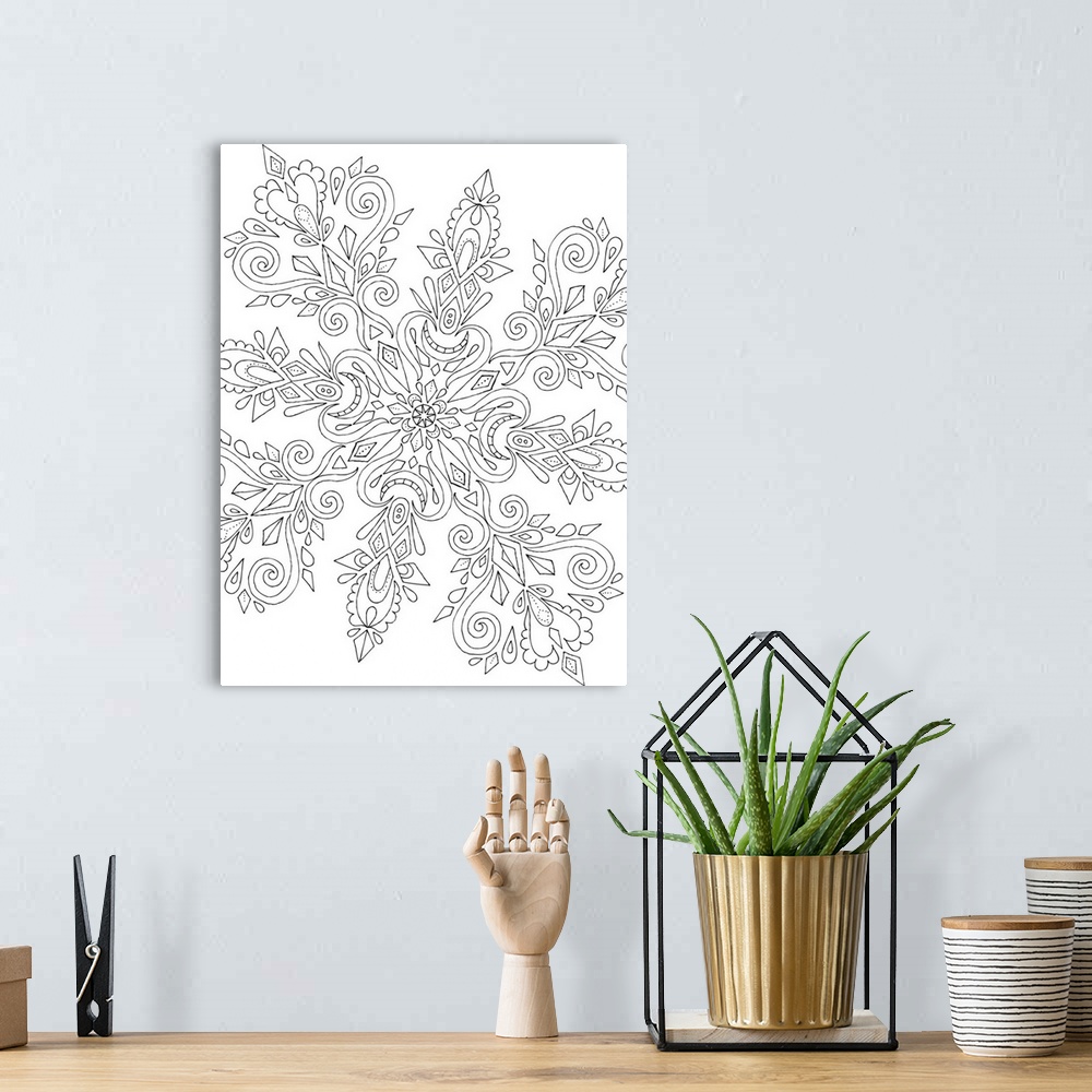 A bohemian room featuring Black and white line art in the shape of a giant snowflake with intricate designs.