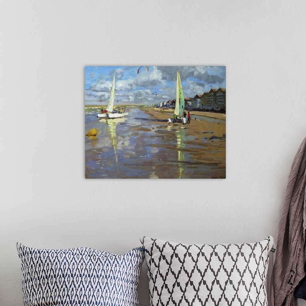 A bohemian room featuring Piece of contemporary artwork that has two sail boats about to set off in the ocean. The beach is...