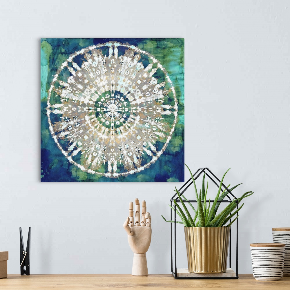 A bohemian room featuring Square abstract decor with a white, gold, and silver mandala on a blue and green watercolor backg...