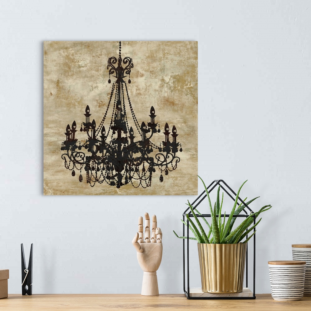 A bohemian room featuring Square decor with a black chandelier on a distressed gold background.
