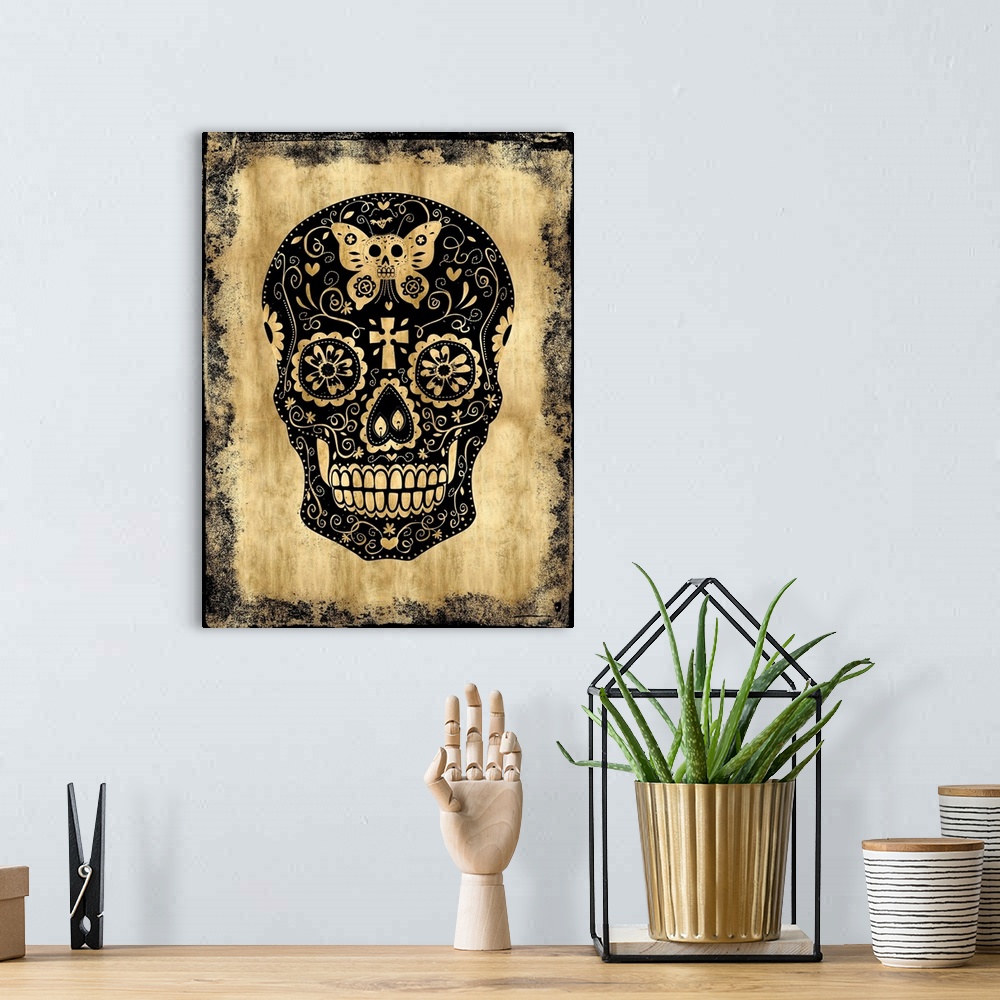 A bohemian room featuring Black and gold Dia De Los Muertos skull.