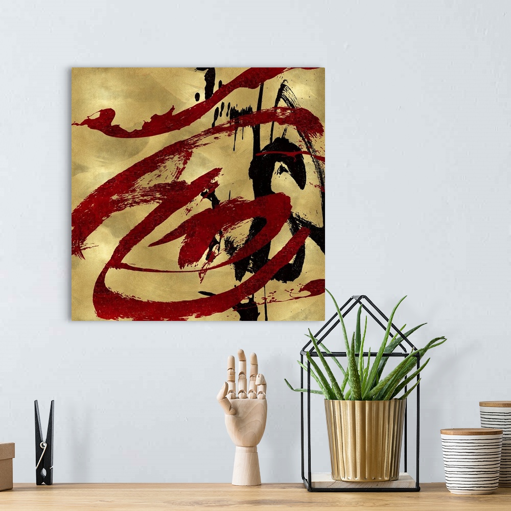 A bohemian room featuring Gestural and energetic brush strokes in black and red decorate a mottled gold color background in...