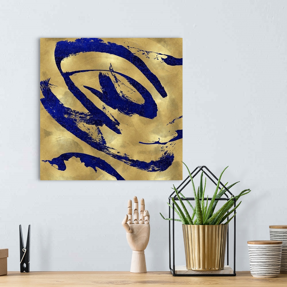 A bohemian room featuring Gestural and energetic brush strokes in blue decorate a mottled gold color background in this con...