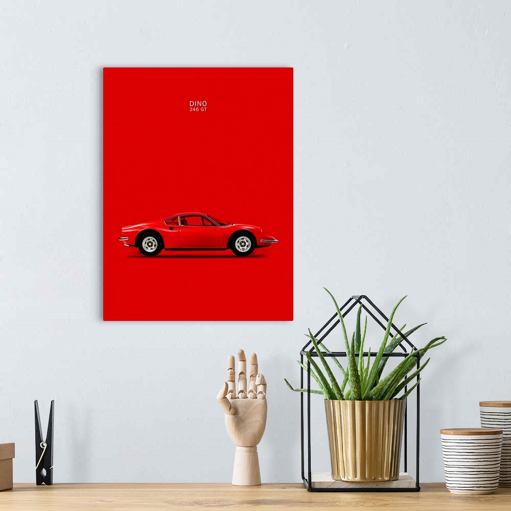 A bohemian room featuring Photograph of a bright red Ferrari Dino 246GT 69 printed on a red background