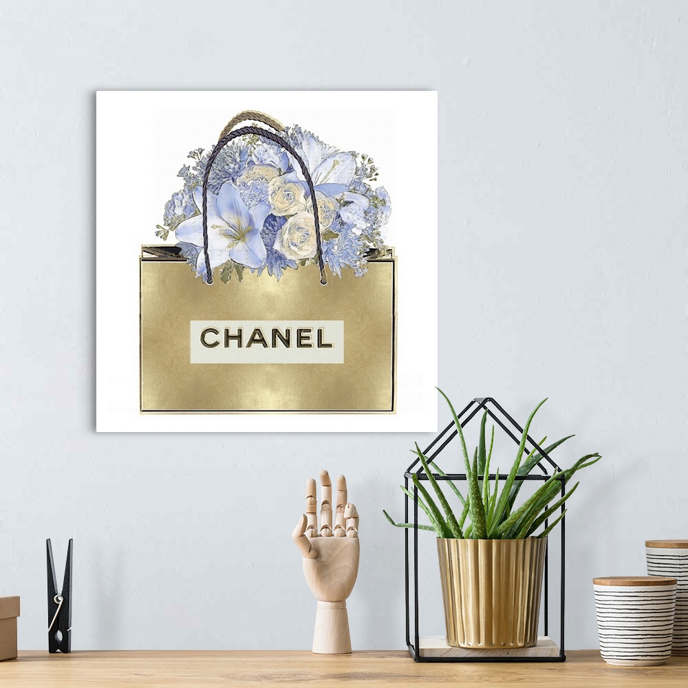 A bohemian room featuring A bouquet of flowers sits atop a shopping bag.