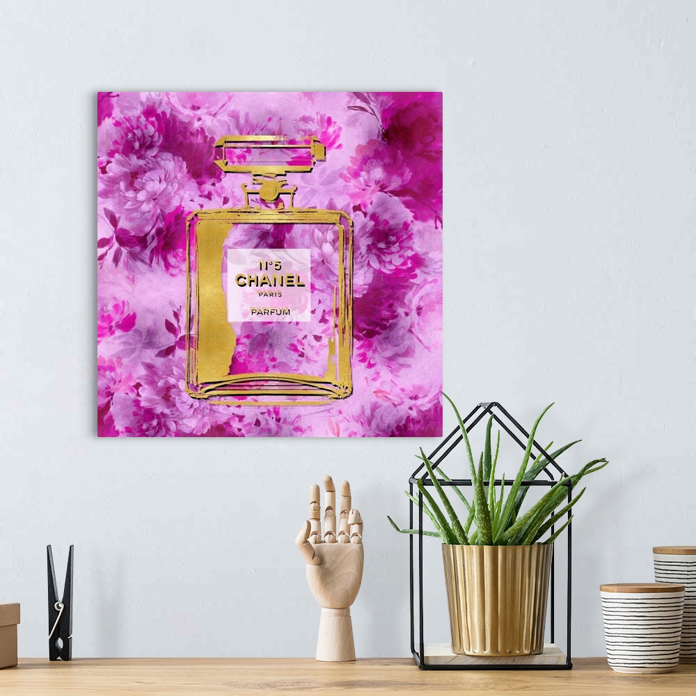 A bohemian room featuring A background of flowers peek through a transparent bottle of perfume.
