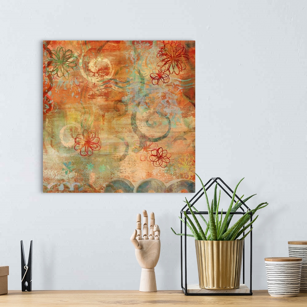 A bohemian room featuring Square abstract art with warm colors, hints of cool blues, and floral illustrations.