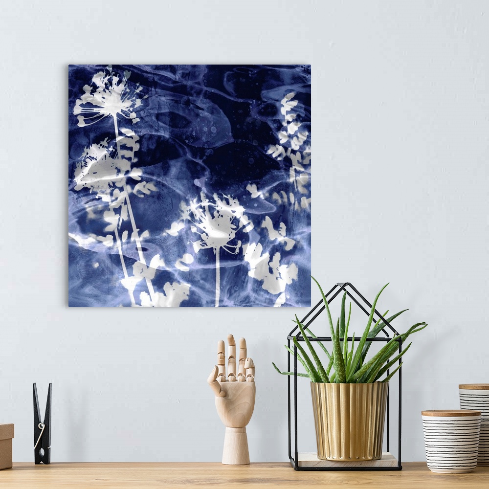 A bohemian room featuring Square home decor with silver silhouettes of leaves and flowers on an indigo background with a wa...