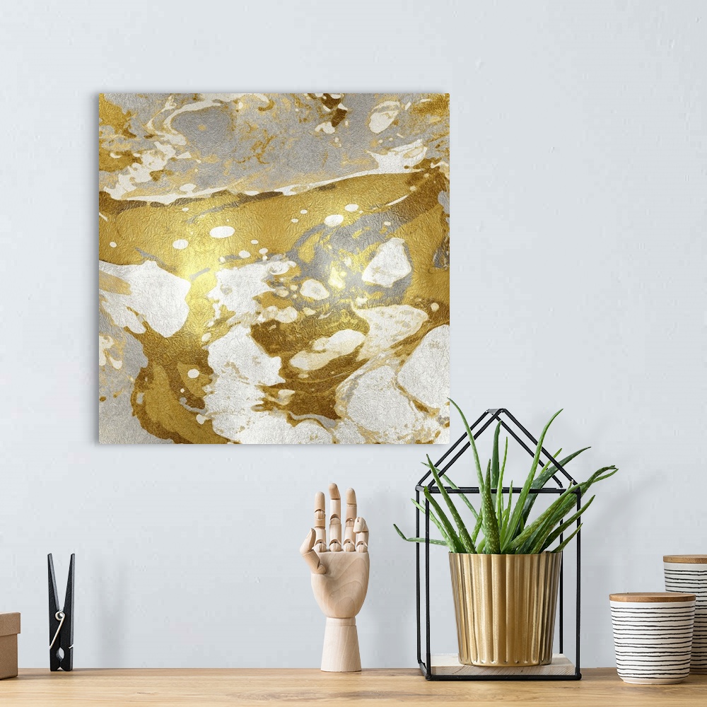 A bohemian room featuring Square abstract art in metallic silver, gold, and white.