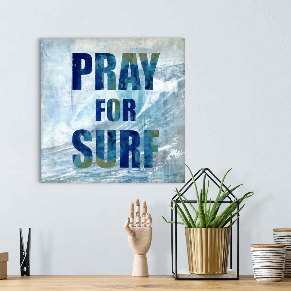 A bohemian room featuring Square beach themed decor with a large wave in the background and "Pray for Surf" written on top.
