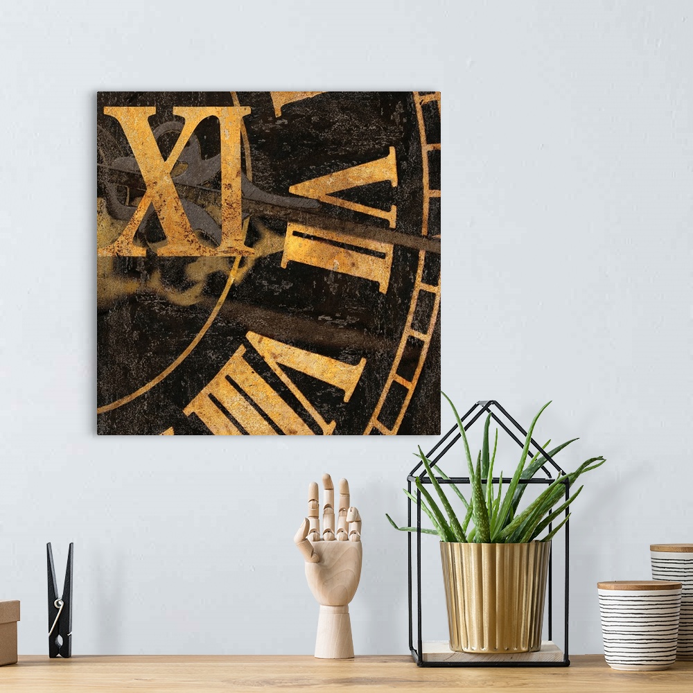 A bohemian room featuring Square decor with a close-up of gold roman numerals on a clock.