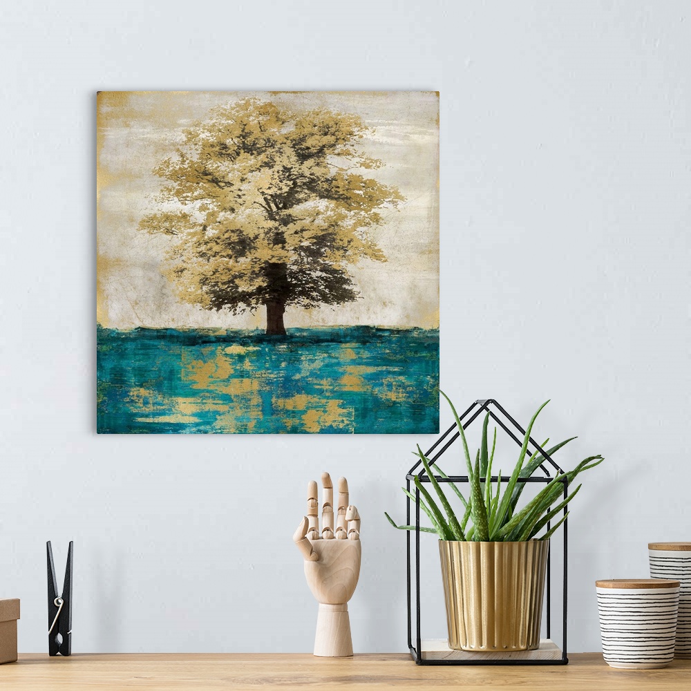 A bohemian room featuring Single metallic gold oak tree isolated on a distressed gray and gold background with teal grass.