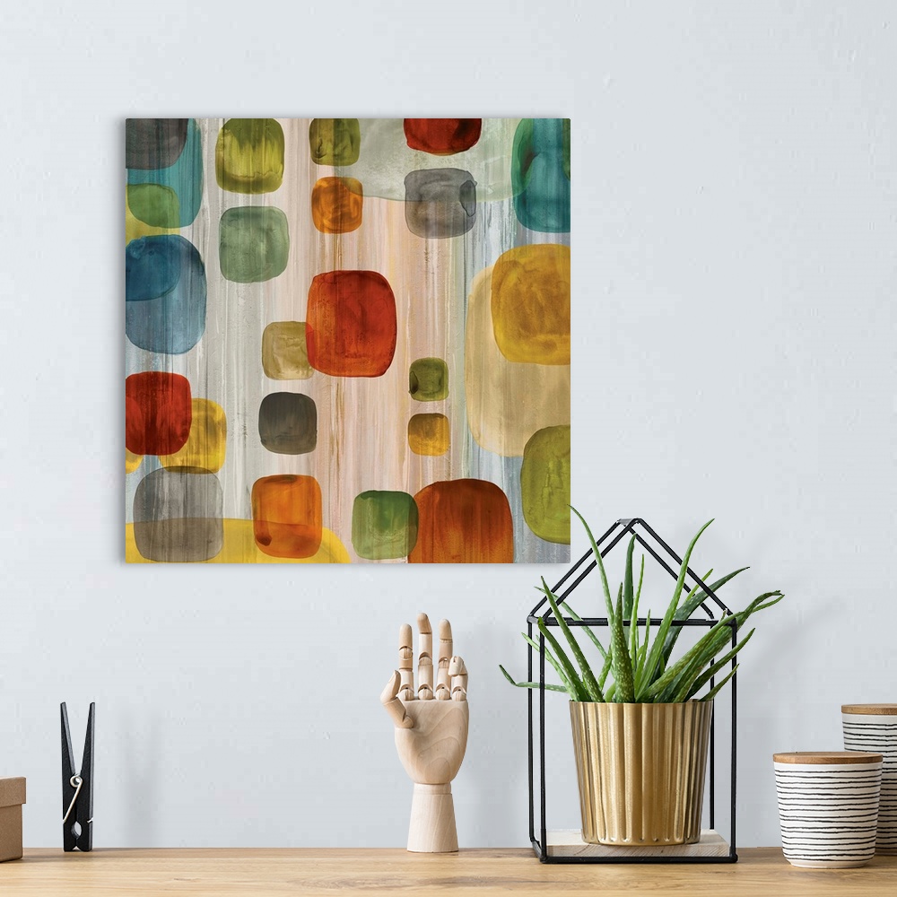 A bohemian room featuring Square abstract art with a vertical lined background and colorful geometric shapes on top in vari...