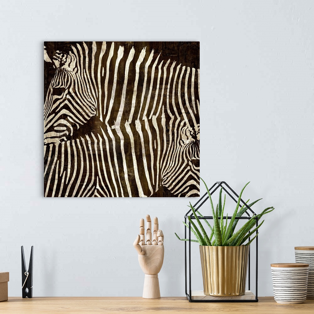 A bohemian room featuring Square wildlife decor with two zebras facing different directions on a brown background.