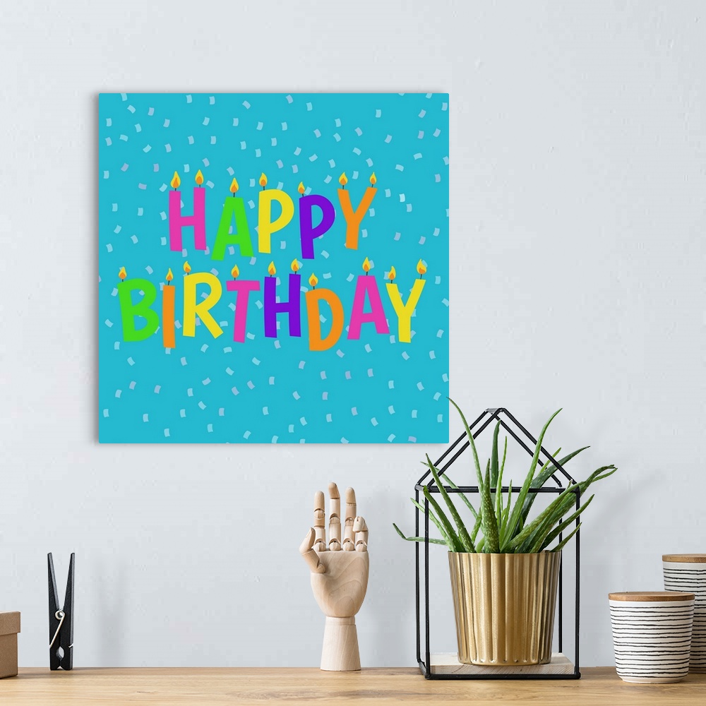 A bohemian room featuring "Happy Birthday" in colorful candle design on a light blue background with confetti.