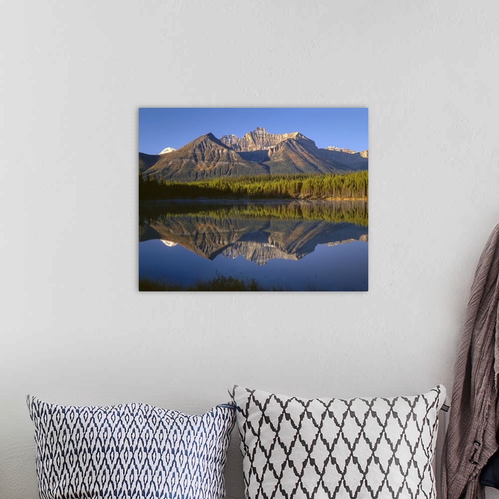 A bohemian room featuring Canada, Alberta, Banff National Park, Early morning light on the Bow Range reflects in Herbert La...
