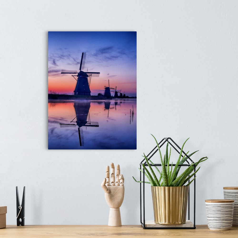 A bohemian room featuring Europe, Netherlands, Kinderdijk, Sunrise along the canal with Windmills.