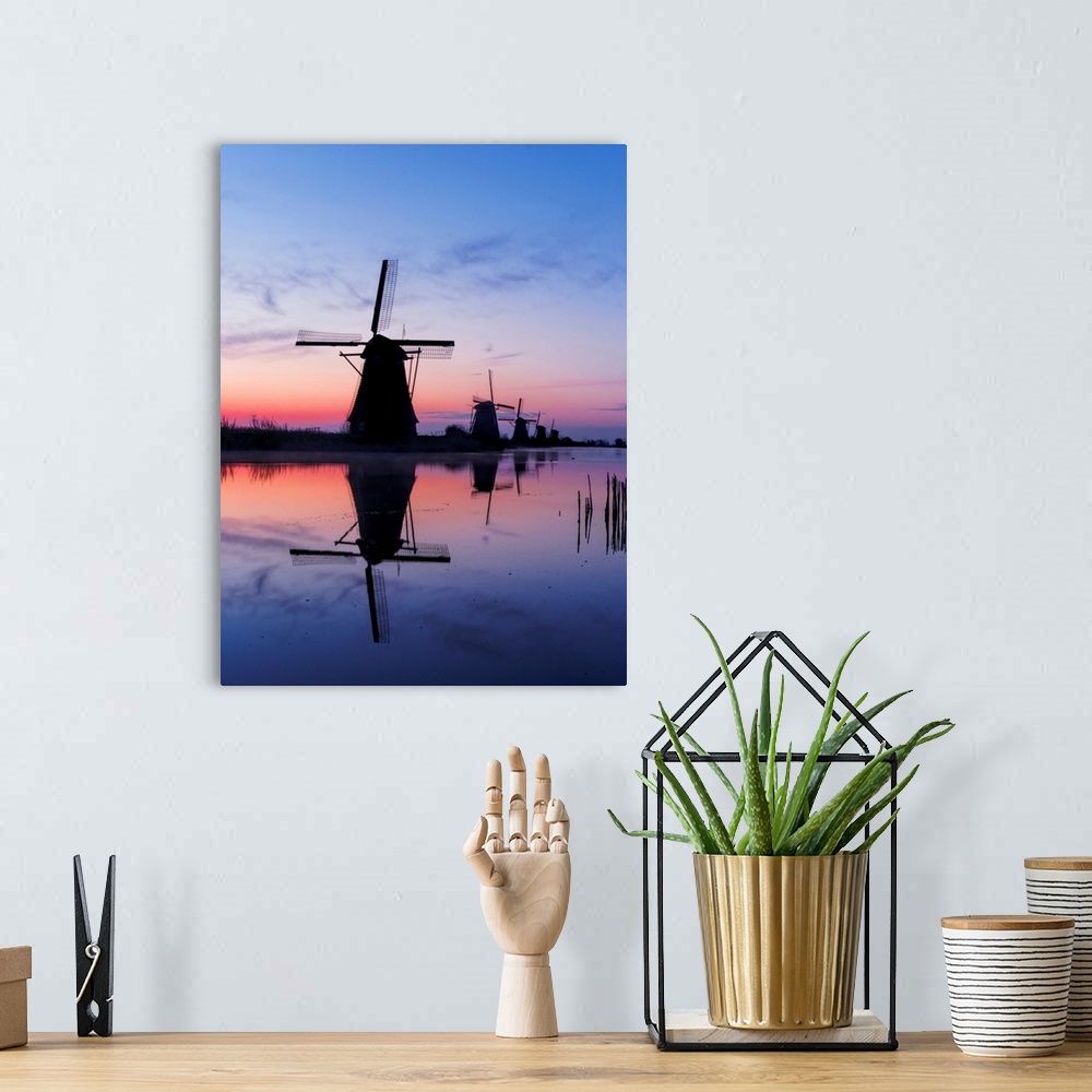 A bohemian room featuring Europe, Netherlands, Kinderdijk, Windmills at Sunrise along the canals of Kinderdijk.