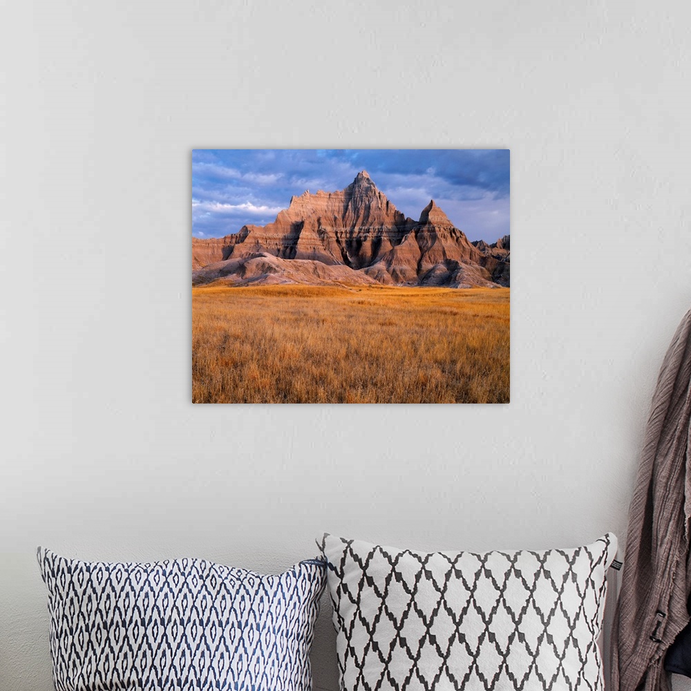 A bohemian room featuring USA, South Dakota, Badlands National Park, North Unit, Storm clouds over Vampire Peak and autumn ...