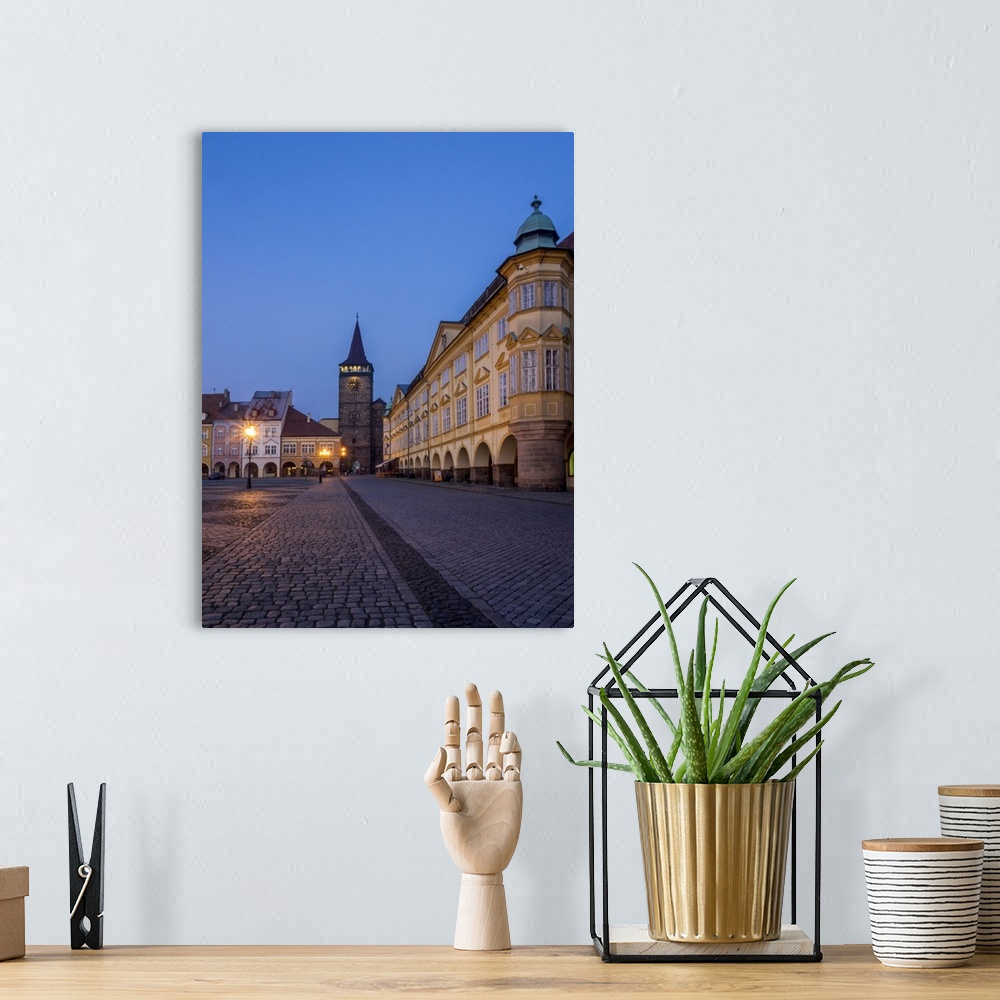 A bohemian room featuring Europe, Czech Republic, Jicin. Twilight in the main square surrounded with recently restored hist...
