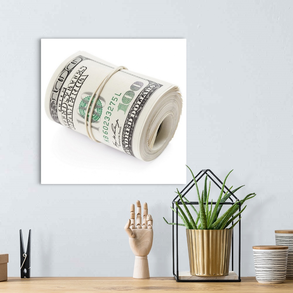 A bohemian room featuring Hundred dollar bills rolled up with rubber band.