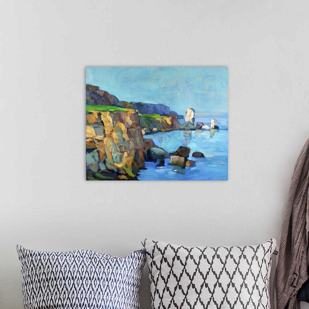 A bohemian room featuring Originally an oil painting of ocean and cliffs on canvas.