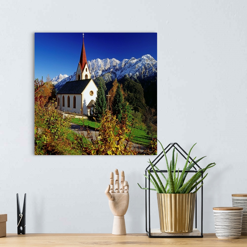 A bohemian room featuring Austria, Tirol, Bannberg church and Lienzer Dolomite mountains in background