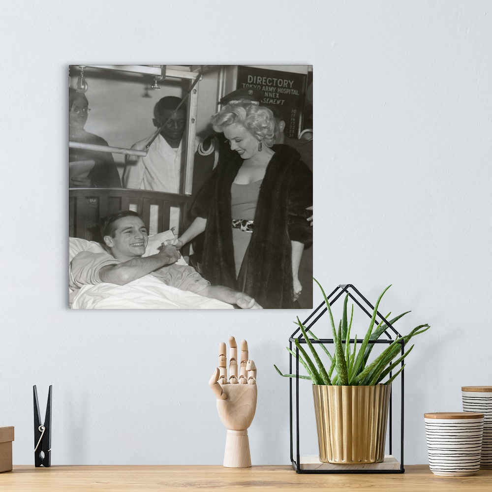 A bohemian room featuring Marilyn Monroe Visiting Wounded Soldier In Hospital In Japan.