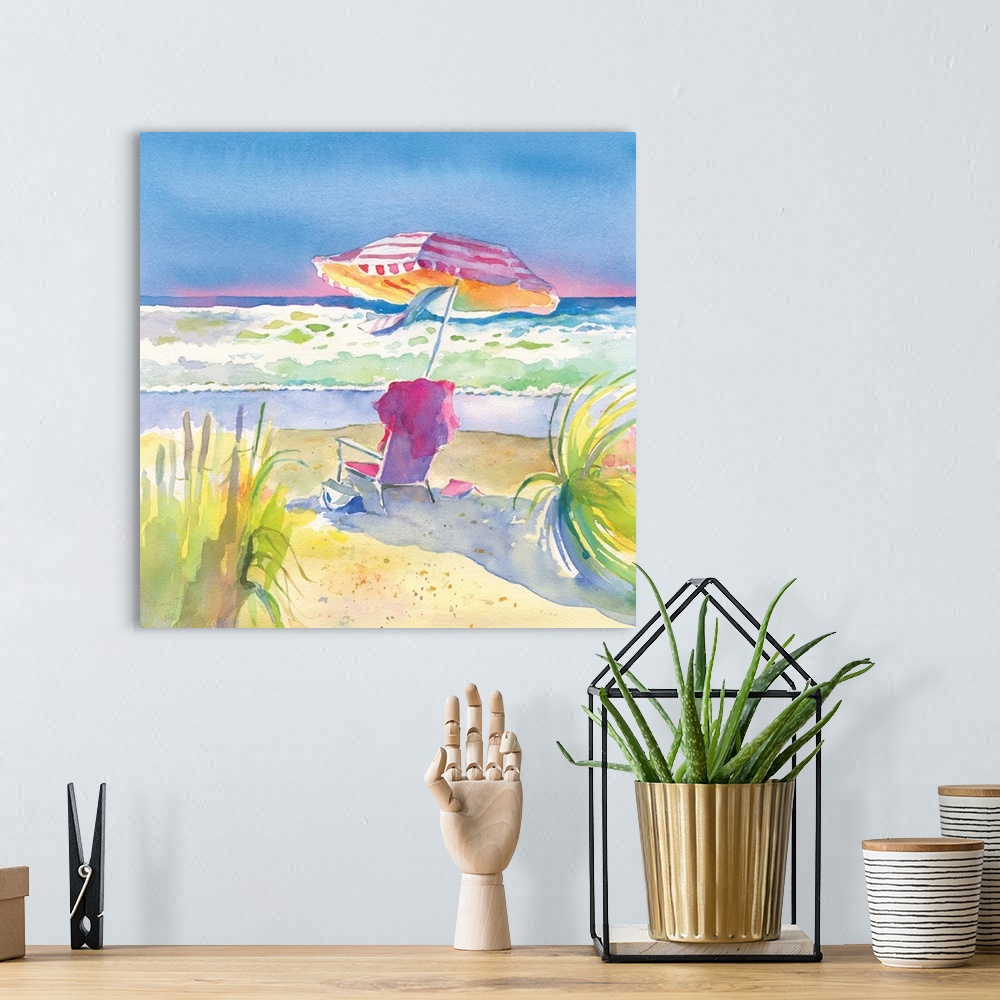 A bohemian room featuring Square watercolor painting of chair and umbrella on the beach in vibrant, warm colors.