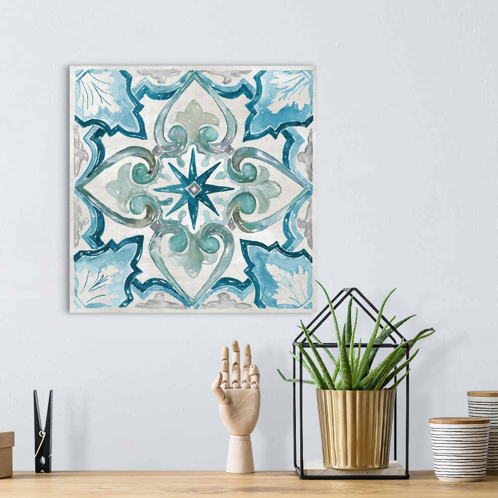A bohemian room featuring Square painting of a symmetrical tile print in blue and green.