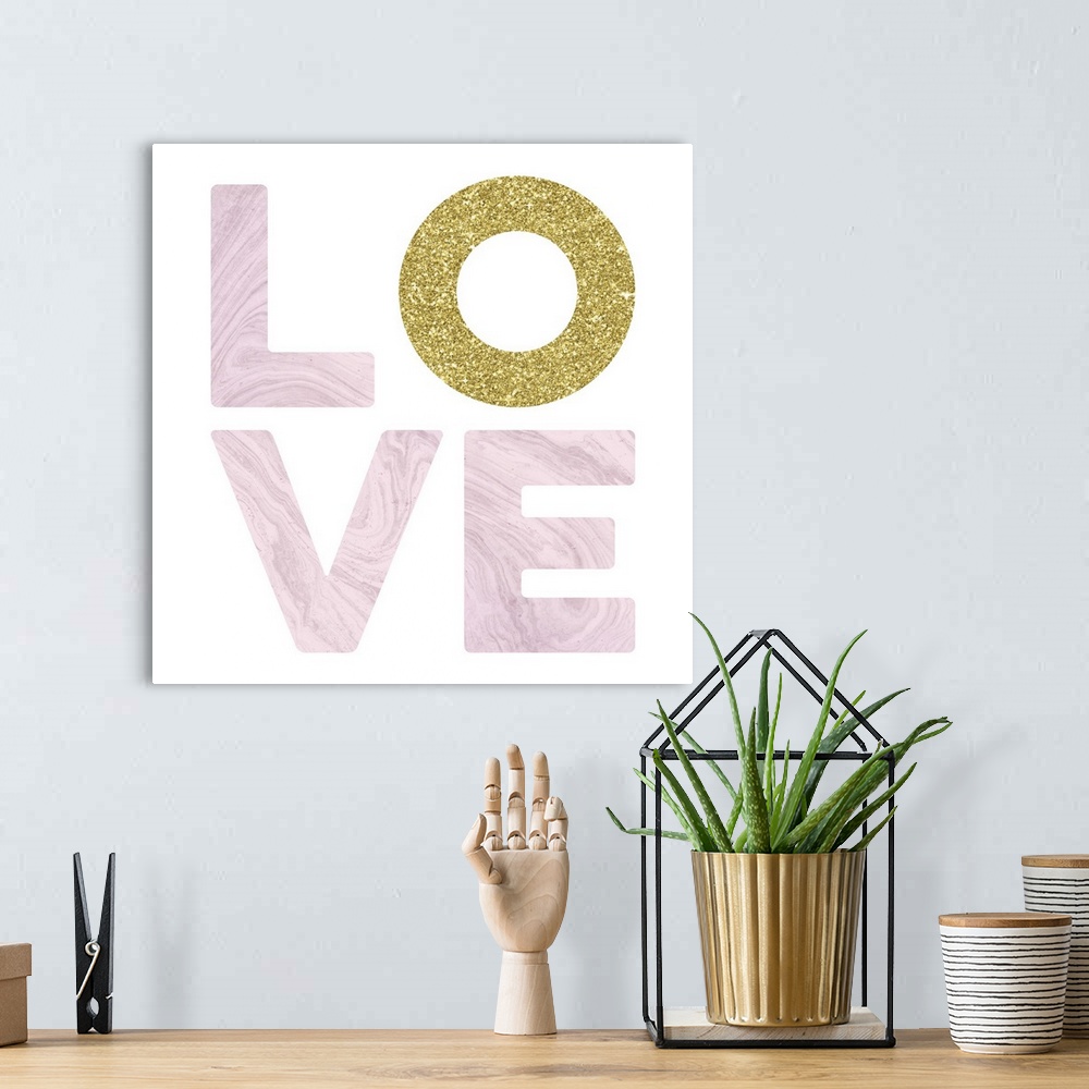 A bohemian room featuring LOVE spelled out in white marble and glitter gold on a white square background with a glitter gol...