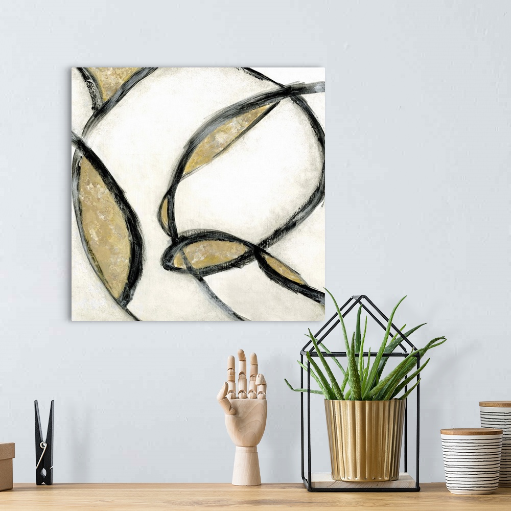 A bohemian room featuring Abstract contemporary painting in swirling black strokes with gold and beige.