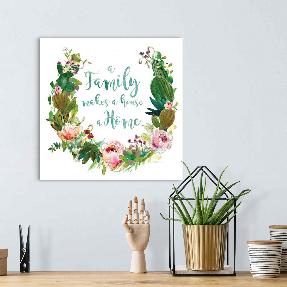 A bohemian room featuring Square watercolor painting with a wreath made out of flowers and succulents and the phrase "A Fam...