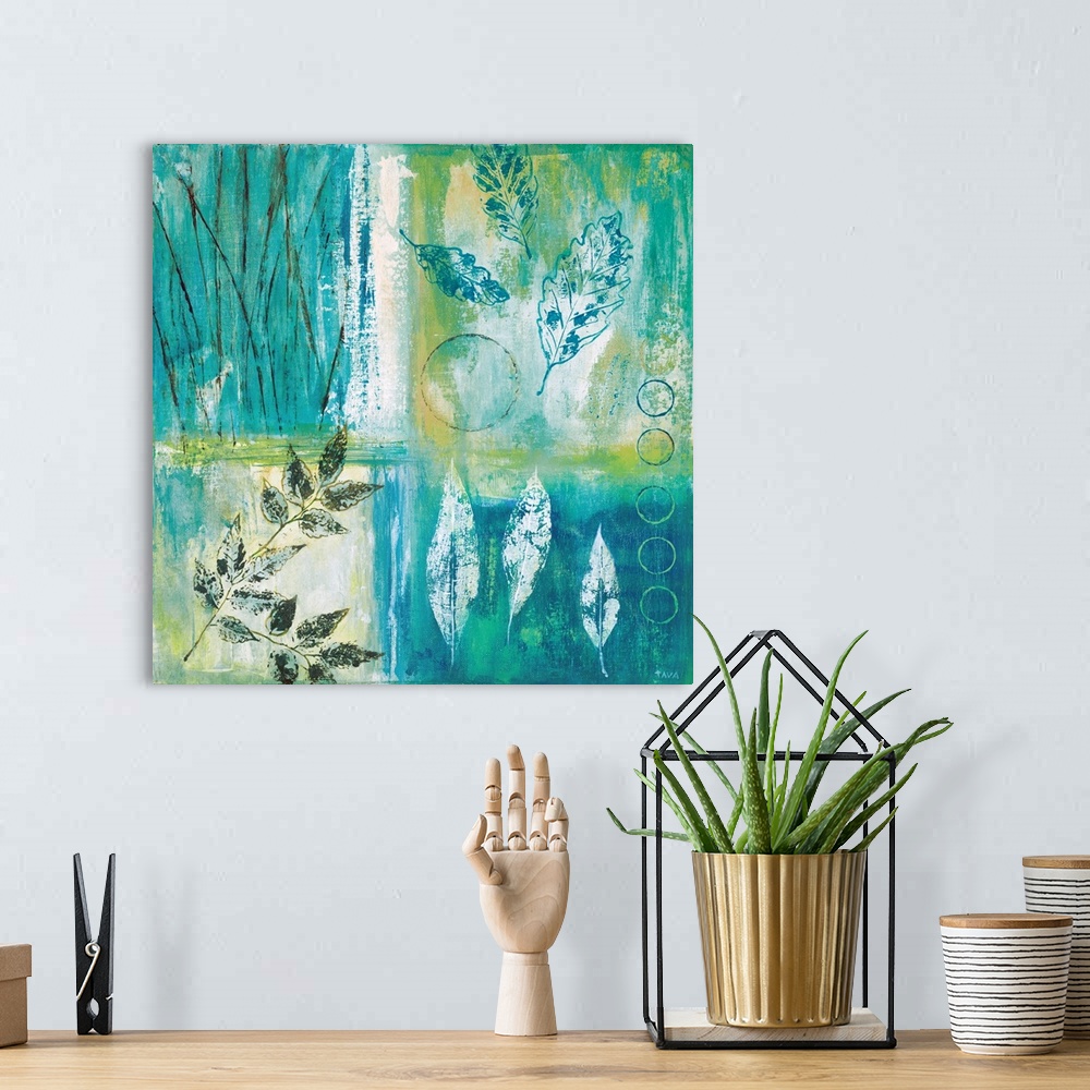 A bohemian room featuring Square painting divided into four sections with different leaf prints in each, made with teal, gr...