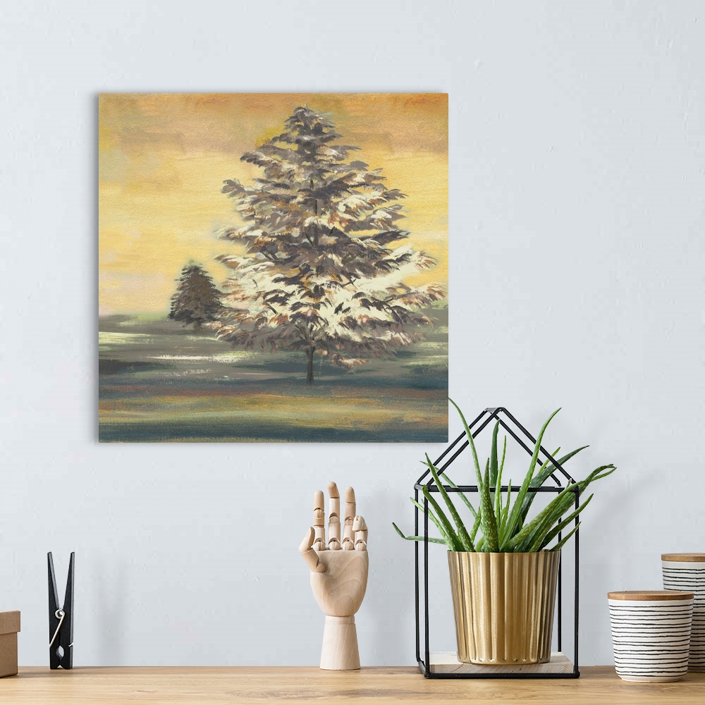 A bohemian room featuring Square painting of an Autumn sunset with two large trees.
