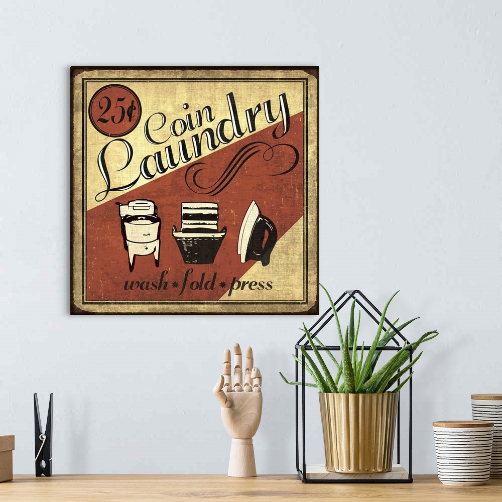 A bohemian room featuring Vintage coin laundry sign in red, black, and cream.