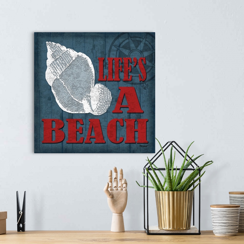 A bohemian room featuring "Life's a beach" square beach decor in blue, red, and white.