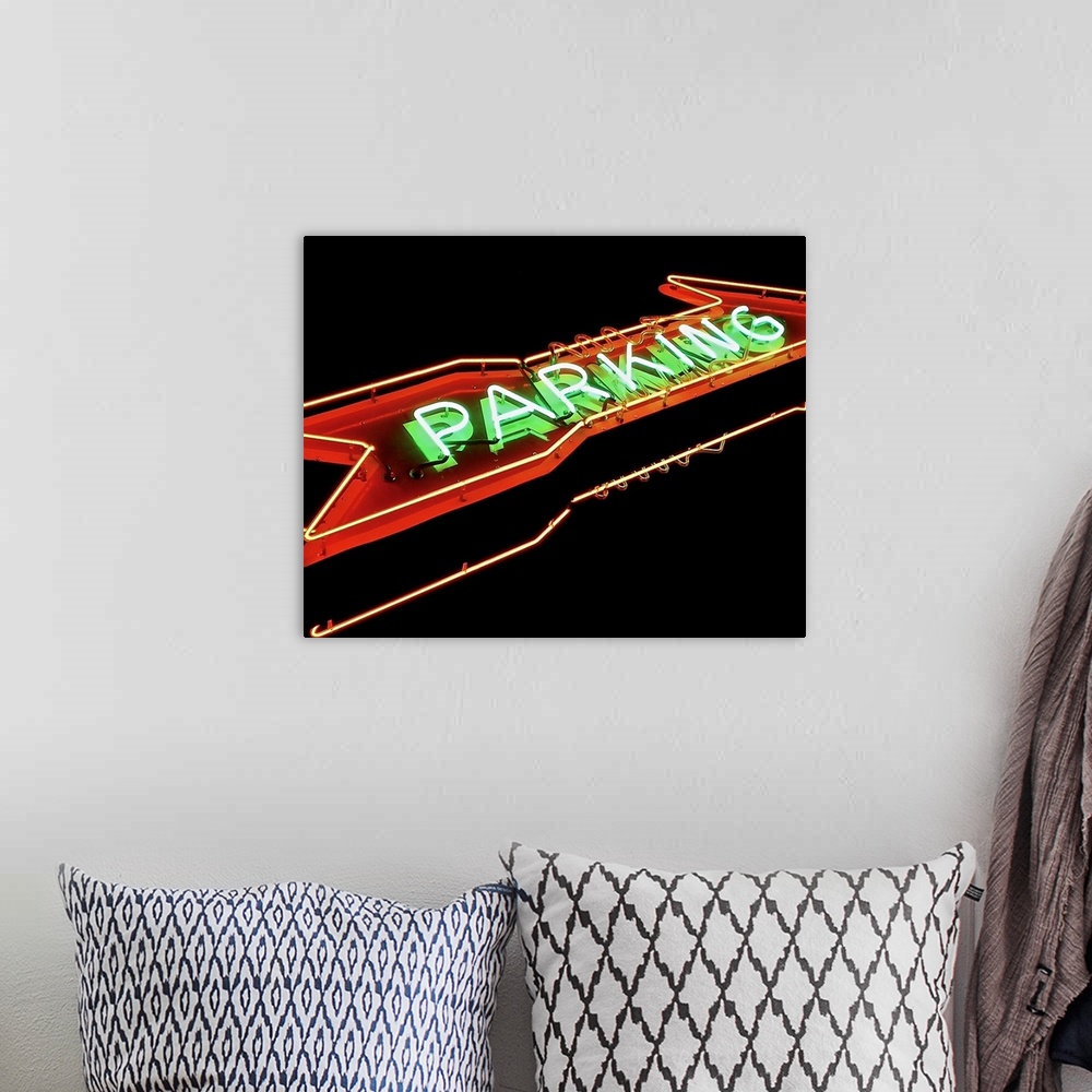 A bohemian room featuring Photograph of a red and green neon arrow sign lit up at night that reads "Parking"