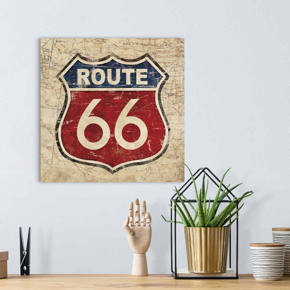 A bohemian room featuring Vintage red and blue Route 66 sign with an old map on the background.