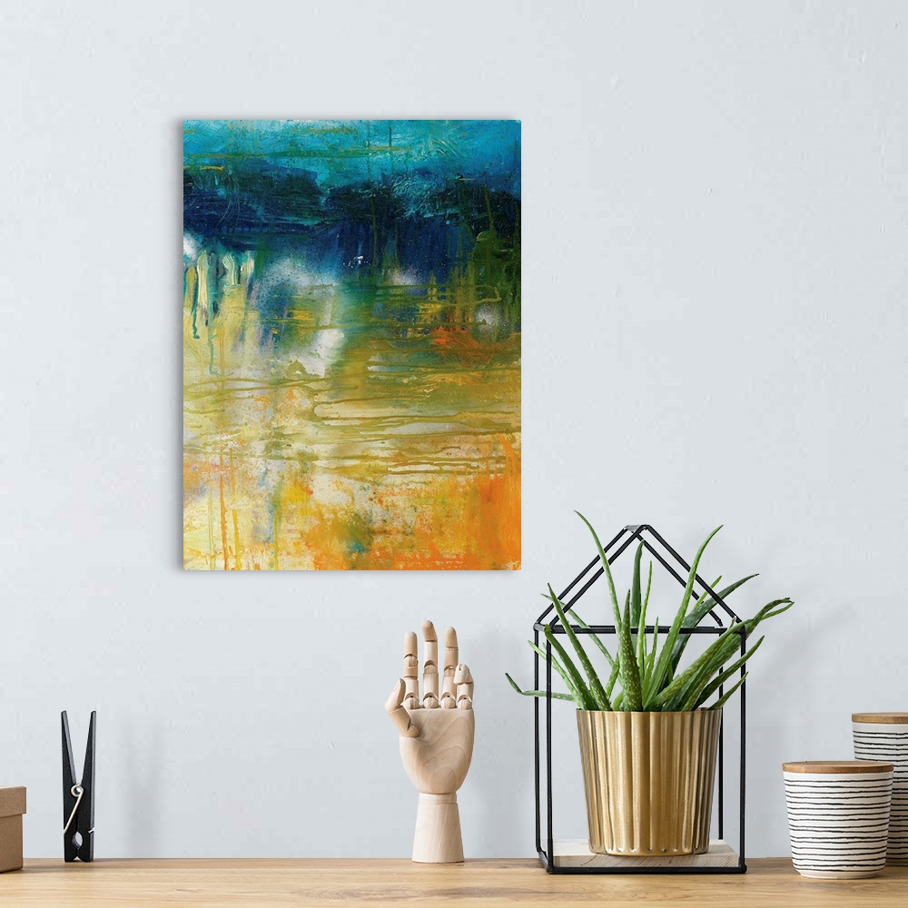 A bohemian room featuring Abstract painting in blue, green, yellow, and orange hues.