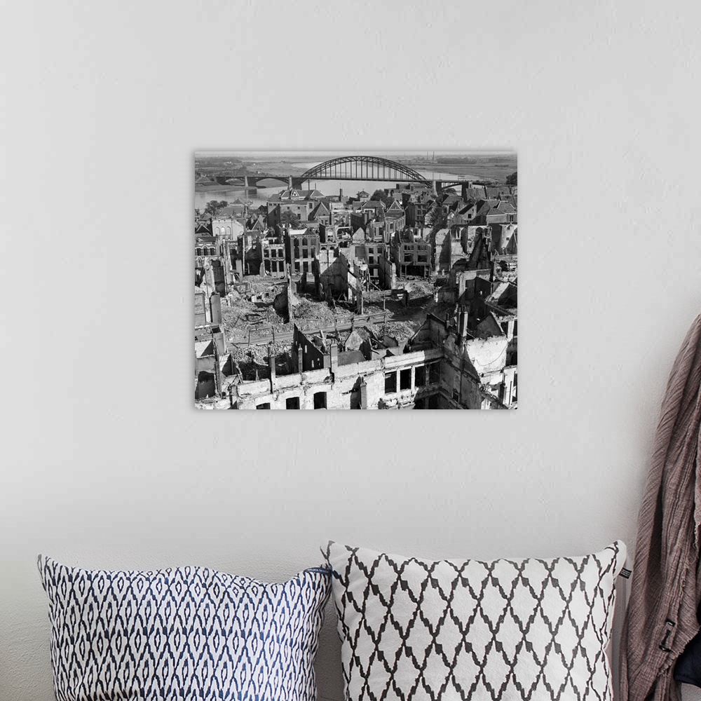 A bohemian room featuring A panoramic view of the city of Nijmegen, Holland, and the Nijmegen Bridge over the Waal (Rhine) ...