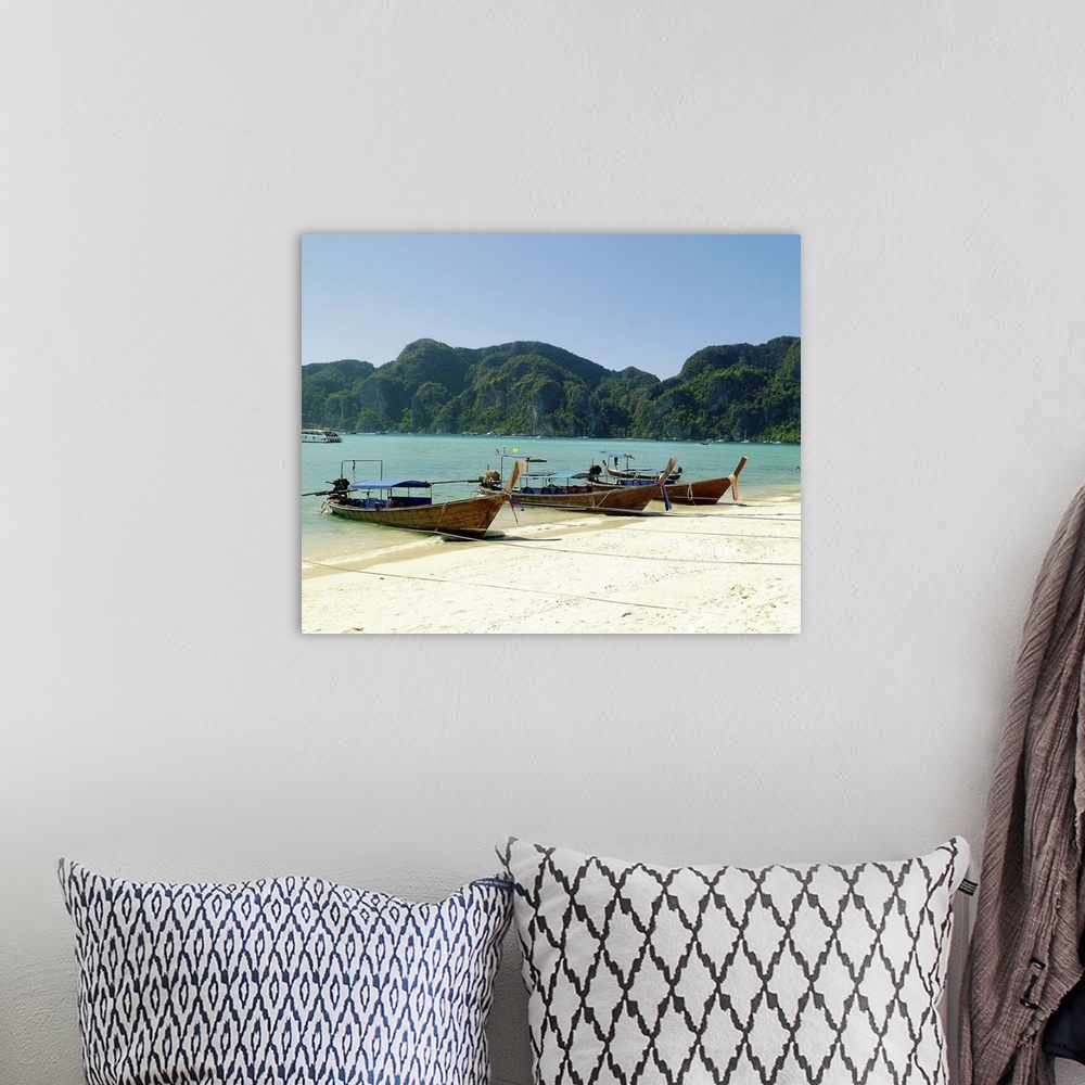 A bohemian room featuring Boats on beach in Thailand.