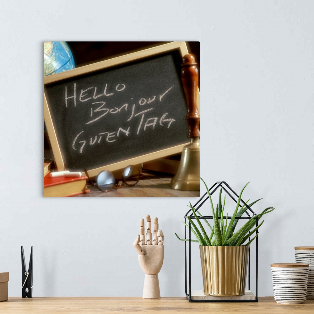 A bohemian room featuring Chalkboard with greetings written in English, French and German